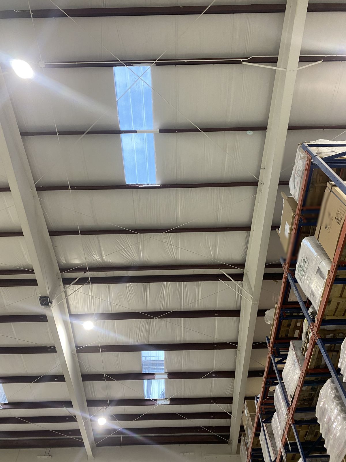 New metal building insulation over warehouse area