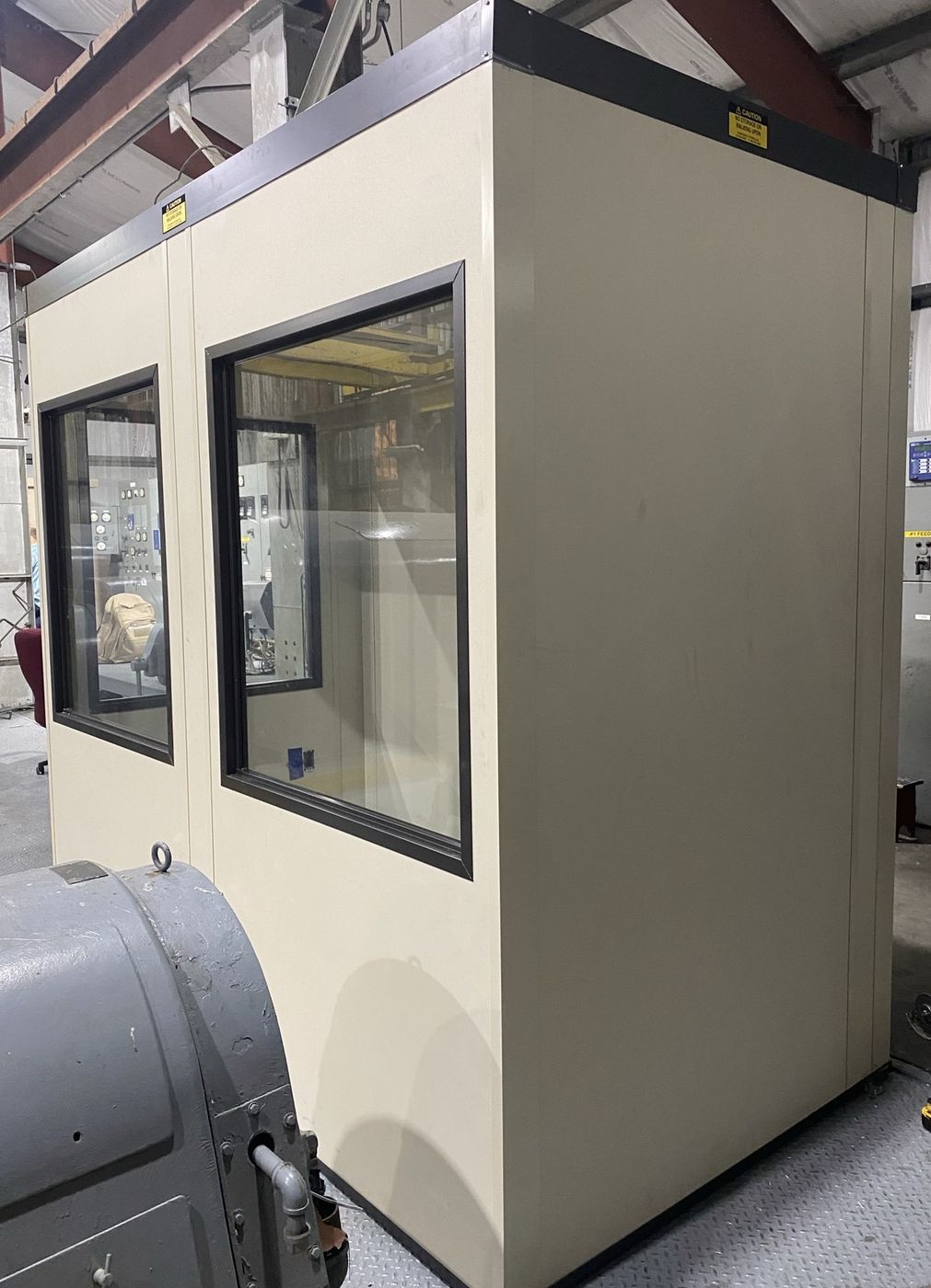Modular in-plant office beside operating equipment
