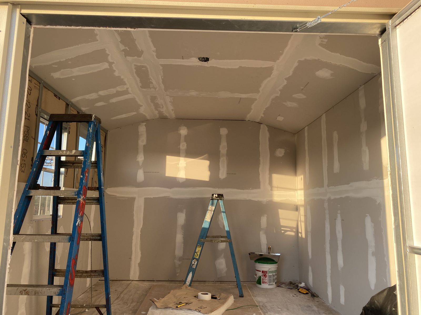 Insulation and drywall installation in progress